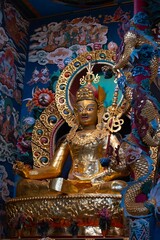 Sculpture of Maitreya Buddha in the Buddha Temple of the Namdroling Monastery in Karnataka, India