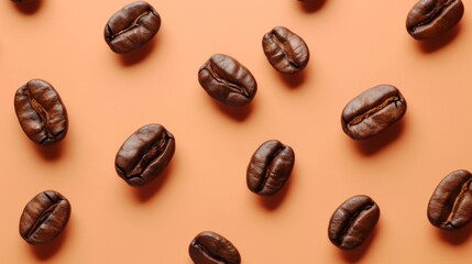Coffee beans in rich brown hues scattered on a soft peach background, creating an elegant pattern with varying orientations. Warm and sophisticated, perfect for coffee designs. - obrazy, fototapety, plakaty
