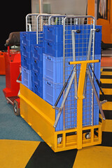 Blue Plastic Crates and Boxes at Pallet Cart Transport in Factory