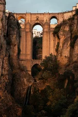 Cercles muraux Ronda Pont Neuf Beautiful view of Puente Nuevo with cliffs and lush greenery. Ronda, Spain.