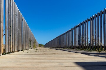 wooden bridge on the way to the beach