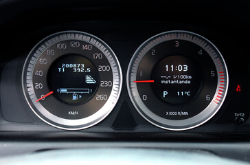 Close-up car panel with a speedometer indicating. Car dashboard. Modern interior.