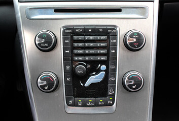 Fototapeta premium Modern car dashboard. Car climate control. Car multimedia system. Climate control dashboard display. Luxury car air conditioner.