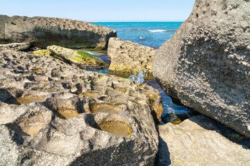 Huge ancient stone blocks on sea shore