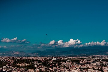Napoli city landscape during summer. Architectural view with Vesuvius volcano in the background