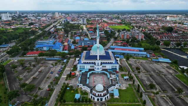 Majestic Mosque Sultan Ismail in Batu Pahat With stands in the center of a bustling urban landscape