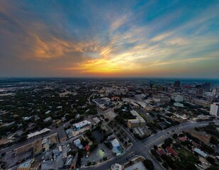 Stunning view of the San Antonio cityscape illuminated by an awe-inspiring orange and blue sunset