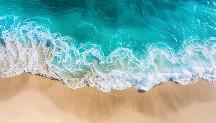 Poster Im Rahmen Aerial view of a tropical beach with turquoise water and white sand under the sunlight. © Maksym