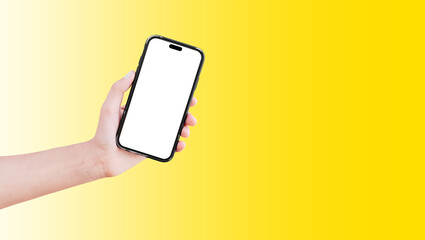 Close-up of hand holding smartphone with blank on screen isolated on background of yellow.