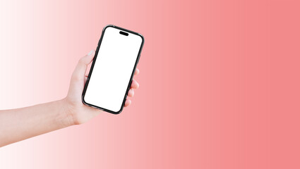 Close-up of hand holding smartphone with blank on screen isolated on background of pastel coral pink.