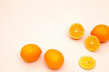 several oranges on top of each other cut in half