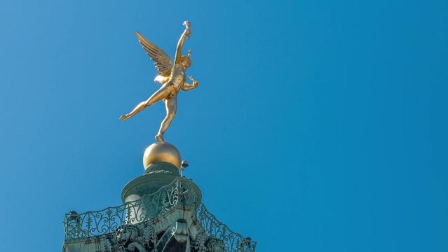 The column and statue at the Place de la Bastille timelapse in Paris. Blue sky at summer day. Close up view