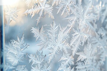 Detailed macro shot of intricate frost patterns on a windowpane during a frosty winter morning