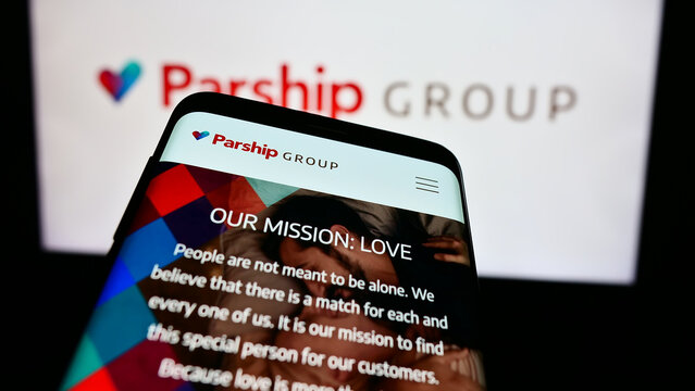 Stuttgart, Germany - 03-17-2024: Mobile phone with website of German online dating company ParshipMeet Holding GmbH in front of business logo. Focus on top-left of phone display.