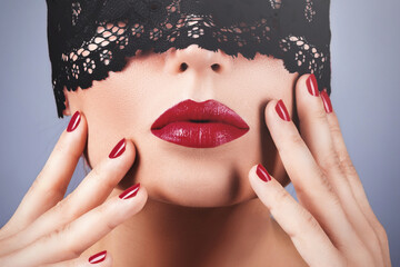 Mysterious Beauty with Black Lace Blindfold and Red Lipstick