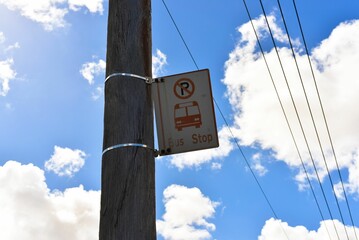 Traffic control sign is affixed to a pole in a public area