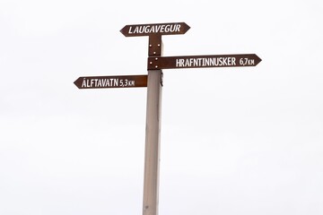 Close-up of multiple road signs indicating directions to several cities and towns