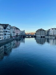 Scenic shot of a large body of water with modern city buildings: Zurich city, Switzerland