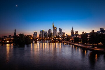 Fototapeta na wymiar Aerial view of a vibrant cityscape of Frankfurt am main illuminated against the night sky