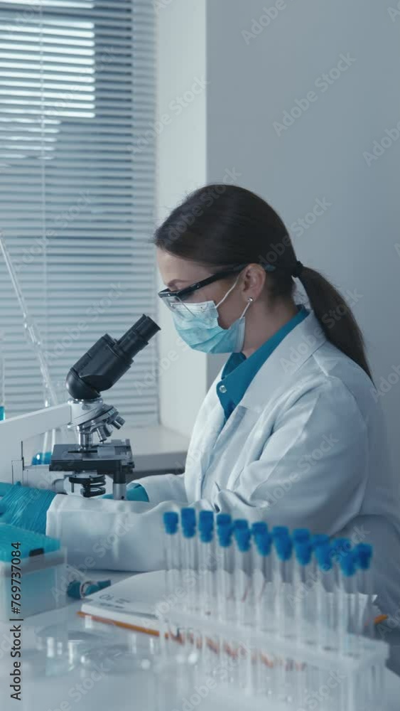 Poster A medical pharmacist-analyst checks the content of active substances in medicines for their effective and safe use. A laboratory assistant helps with experiments and keeps the laboratory tidy.
