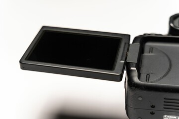the screen is opened to allow the flash light on the camera