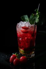 Refreshing strawberry mojito on a dark background