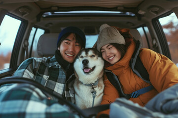 Happy couple and their dog enjoying a road trip adventure in the back seat of a car, traveling together with joy