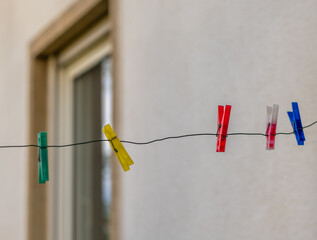 row of colorful clothespins hanging on a line