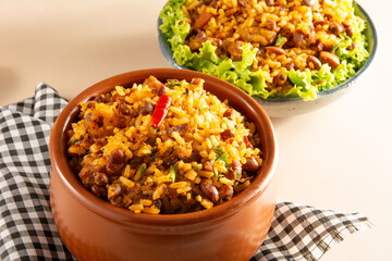 Baião de Dois traditional Brazilian food made with rice, beans, sausage and rennet cheese