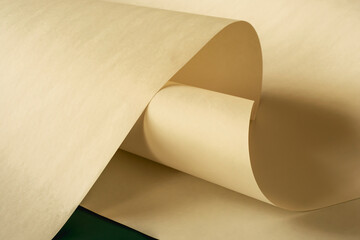 A large long sheet of paper in a warm vintage color as a background.