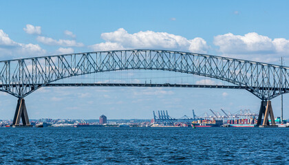 Francis Scott Key Bridge - Baltimore, Maryland USA - Patapsco River - Cargo Ships and Baltimore Cityscape in Background