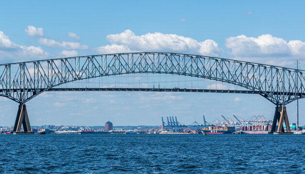Francis Scott Key Bridge - Baltimore, Maryland USA - Patapsco River - Cargo Ships and Baltimore Cityscape in Background