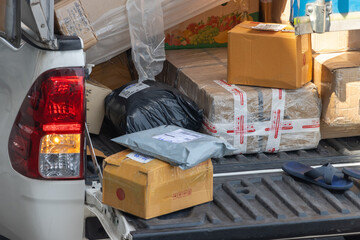 Packages on the pick-up car of parcel service is ready for delivery
