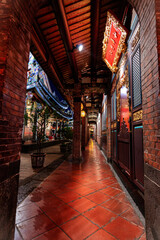 Night view over the corridor of rear hall in Baoan Temple of Taipei, Taiwan. The temple received...