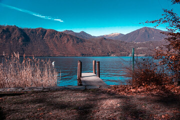 Charming view of the lake in a winter morning, hills in the background (Lake Orta - Italy).