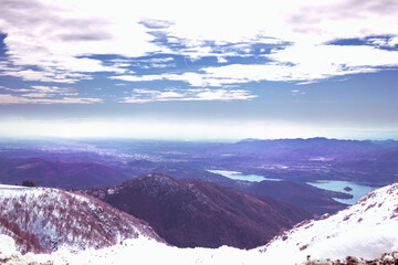 From the car window, after a snowfall. Surreal view from the top of the mountain. Mottarone...