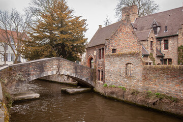 Beautiful houses along the canals of Brugge, Belgium. Tourism destination in Europe - 769785244