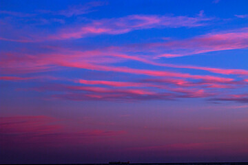Fototapeta na wymiar Beautiful clouds in a colorful sky at sunset in summer