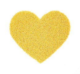 A heart made of millet. Isolated on a white background.