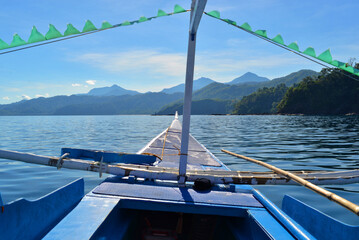 A traditional Filipino touristic fishing boat Bangca floating in the sea in El Nido