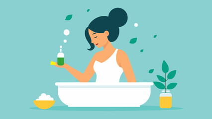  A woman adds a few drops of peppermint oil to her bath enjoying the invigorating and rejuvenating properties.