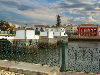 Tavira with view at the medieval bridge over river Gilao, Algarve, Portugal - 769814604