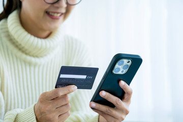 Woman spend time at home seated on sofa