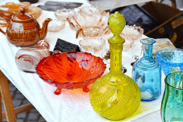 Set of glass decanter jug, vase, fruit stand old vintage glassware garage sale on flea market. - Powered by Adobe