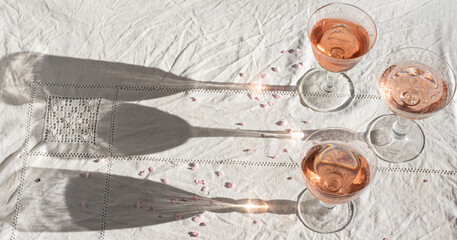 Rose wine in vintage glasses, romantic mood, spring vibes tenderness and sunny morning light, romantic mood. Eco linen background, natural spring light.  Romantic still life - 769834439