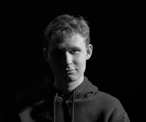 male teenager black and white high contrast short light portrait