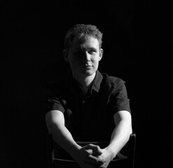 Fototapeta premium male teenager black and white high contrast short light portrait