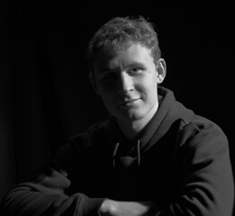 Fototapeta premium male teenager black and white high contrast short light portrait