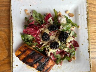 Fresh spring salad with grilled salmon - 769837426