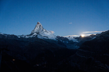 Majestic Matterhorn mountain with stars and moonlight shines in the dawn at Zermatt, Switzerland - 769849824